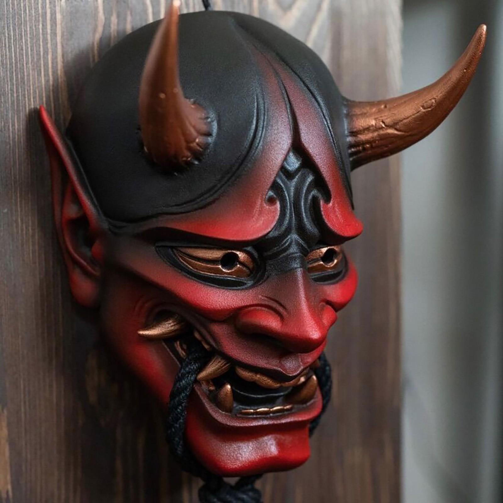 Японська маска демона на обличчі карнавальна